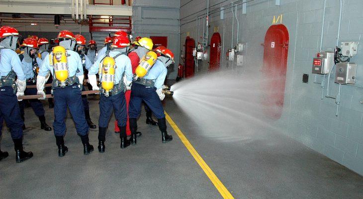 070814-N-8848T-050.NAVAL STATION GREAT LAKES, Ill. (Aug. 14, 2007) – Recruits from Division 253 charge the nozzle of a fire hose at Recruit Training Command’s Fire Fighting school here. Division 253 is the third Special Warfare Operations division to go through recruit training. The division is made up of rating candidates for special warfare operator, special warfare boat operator, Navy diver and explosive ordnance disposal (EOD). It is part of a new Navy and Special Warfare Command initiative to grow the ranks of SEALs, littoral and riverboat squadrons, dive units and EOD detachments. U.S. Navy photo by Mr. Scott A. Thornbloom (RELEASED).
